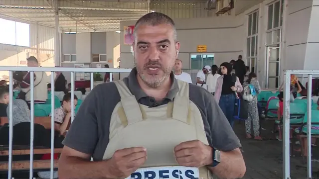 Rushdi Abualouf stands at the Gaza side of the Rafah crossing