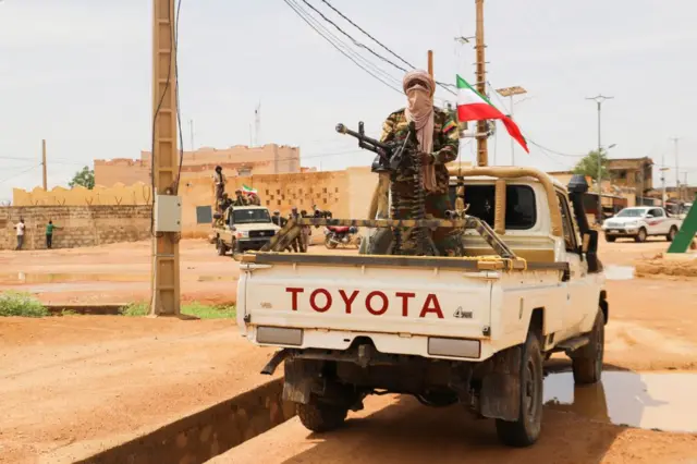 A fighter for Coordination of Azawad Movements (CMA) patrols through town during the Congress for the Fusion of Movements in Kidal on August 28, 2022.