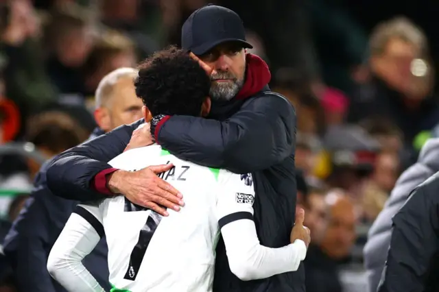 Juergen Klopp hugs Luiz Diaz