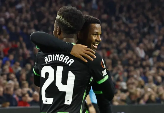 Simon Adingra and Ansu Fati celebrate a goal for Brighton