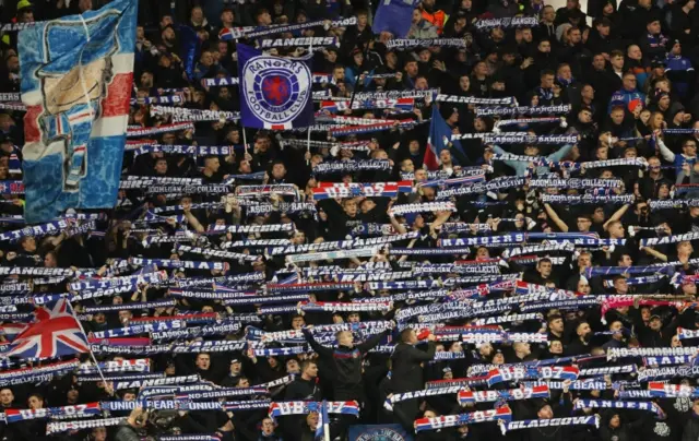 Rangers fans hold their scarves aloft during their win over Sparta Prague