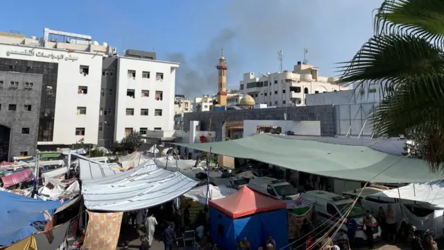 Al Shifa hospital with smoke in the background, photo taken on 9 November