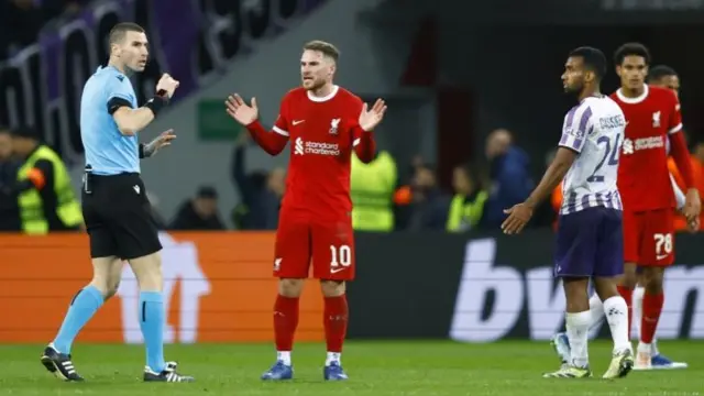 Alexis Mac Allister appeals to referee Georgi Kabakov as Jarell Quansah's goal is disallowed