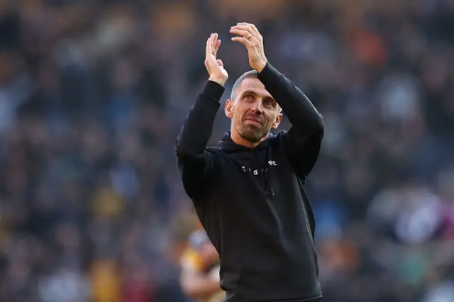 Gary O'Neil applauds fans on the pitch