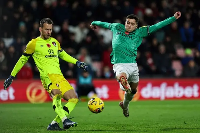 Ben Parkinson jumps to stop a shot by Bournemouth's goalkeeper Neto