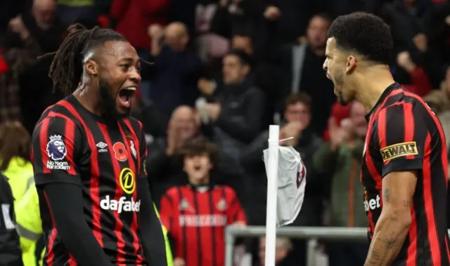Dominic Solanke celebrates scoring their first goal with teammate Antoine Semenyo