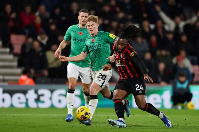 Lewis Hall fights for the ball with Bournemouth's striker Antoine Semenyo