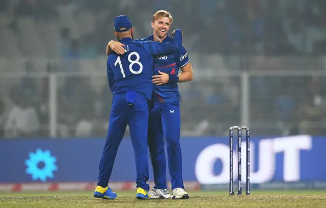 David Willey celebrates the wicket of Salman Agha