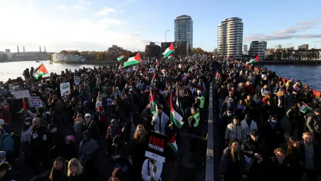 People demonstrate on Vauxhall Bridge during a protest in solidarity with Palestinians in Gaza