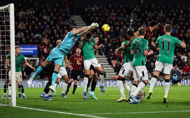 Nick Pope punches the ball away