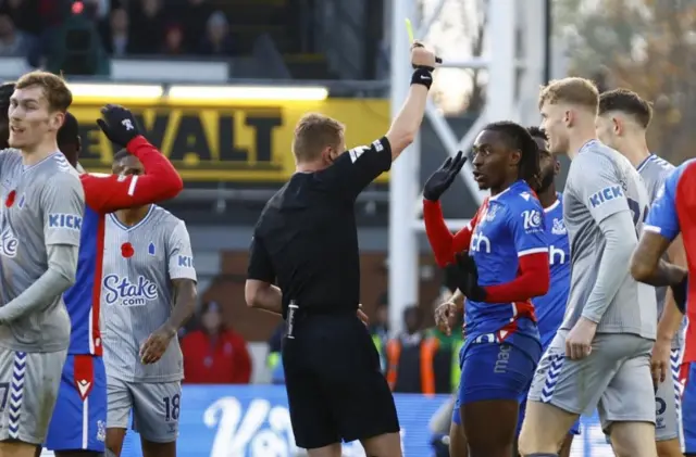 Eberechi Eze receives a yellow card
