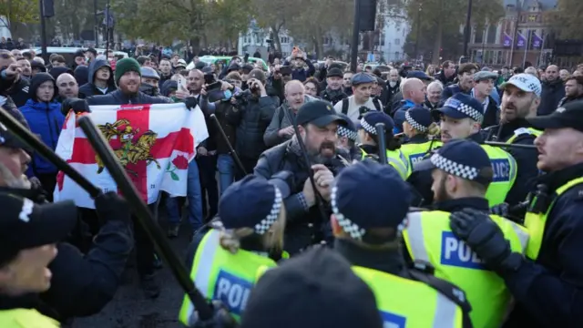 Counter-protesters clash with police in Parliament Square in central London