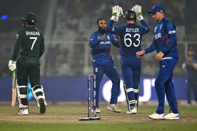 Adil Rashid celebrates bowling Shadab Khan