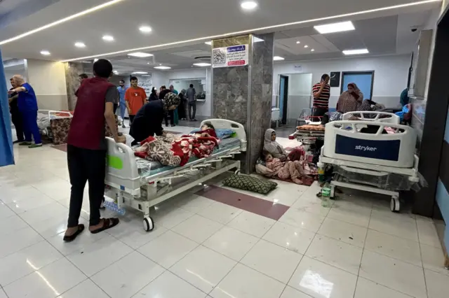 A crowd of people inside Al-Shifa hospital