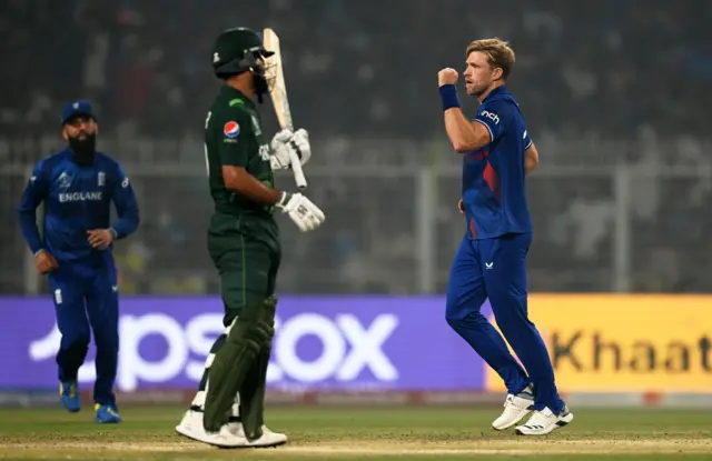 David Willey celebrates the wicket of Fakhar Zaman