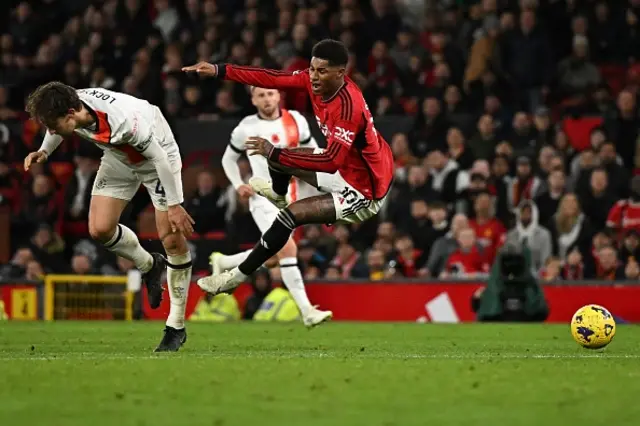 Marcus Rashford goes down