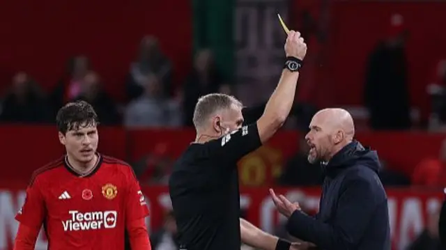 Erik ten Hag is given a yellow card by the referee