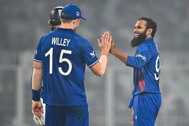 Adil Rashid celebrates the wicket of Saud Shakeel