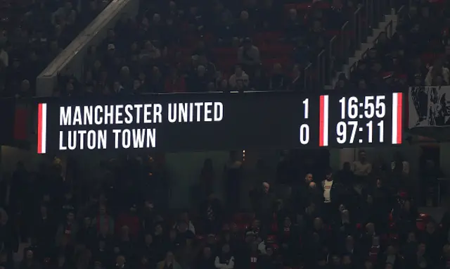 Scoreboard within the stadium shows the score