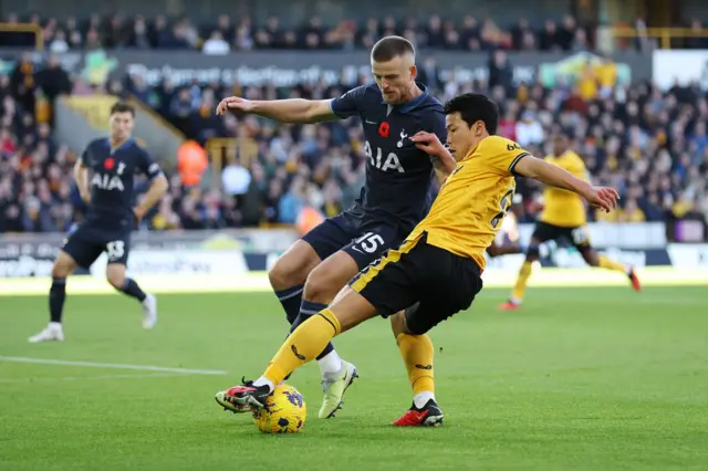 Hwang Hee-chan and Eric Dier