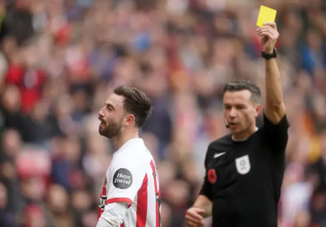 Sunderland's Patrick Roberts is shown a yellow card