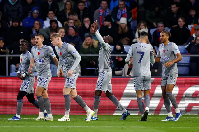 Everton players celebrate after scoring
