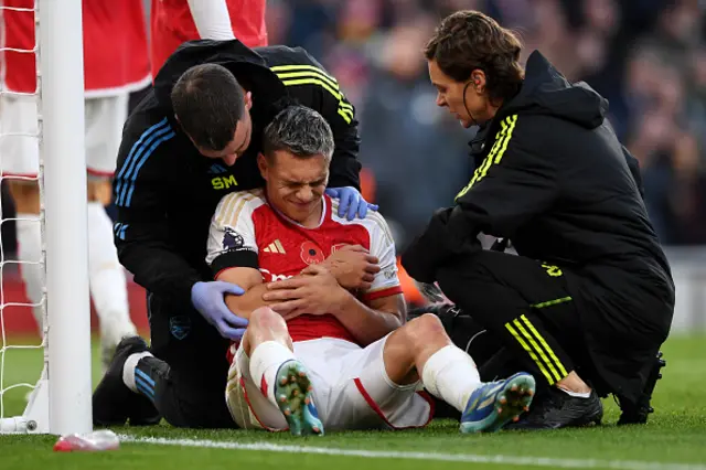 Leandro Trossard of Arsenal receives medical treatment