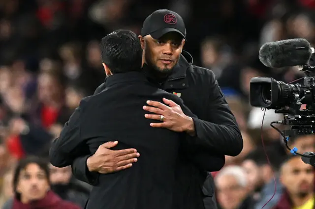 Vincent Kompany and Mikel Arteta hug on the touchline