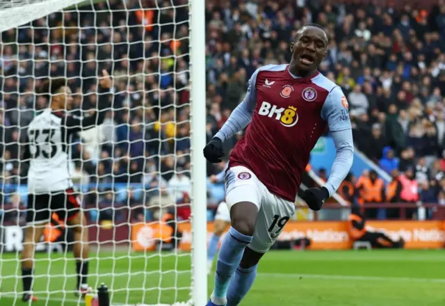 Moussa Diaby runs off to celebrate the own goal