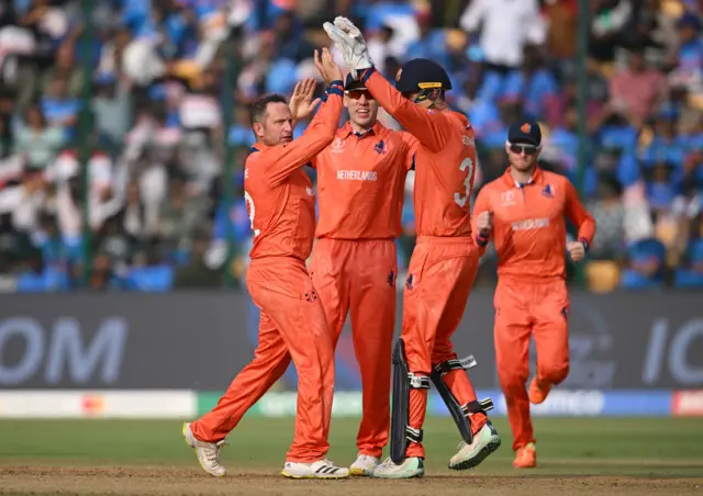 Roelof van der Merwe celebrates the wicket of Virat Kohli