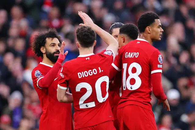 Mohamed Salah of Liverpool celebrates with teammate Diogo Jota