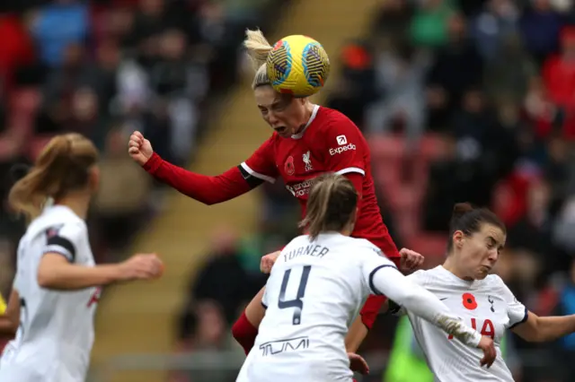 Roman-haug rises highest to head home the equaliser for Liverpool.