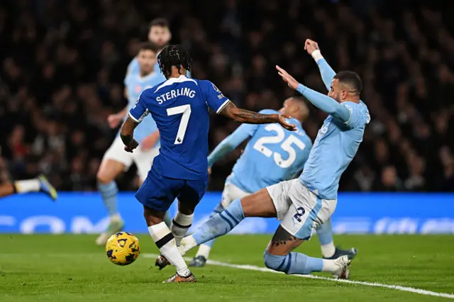 Raheem Sterling shoots as Kyle Walker attempts to block it