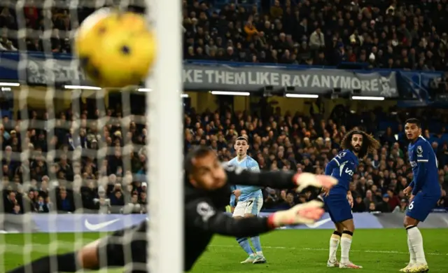 Phil Foden looks on as his shot goes wide