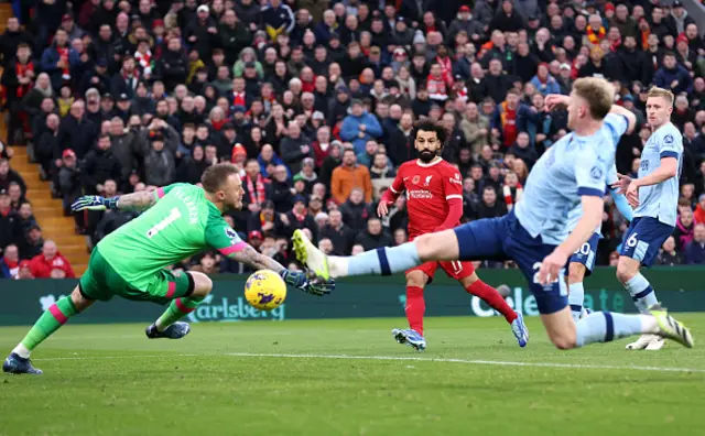 Mohamed Salah shoots as goalkeeper  Mark Flekken dives