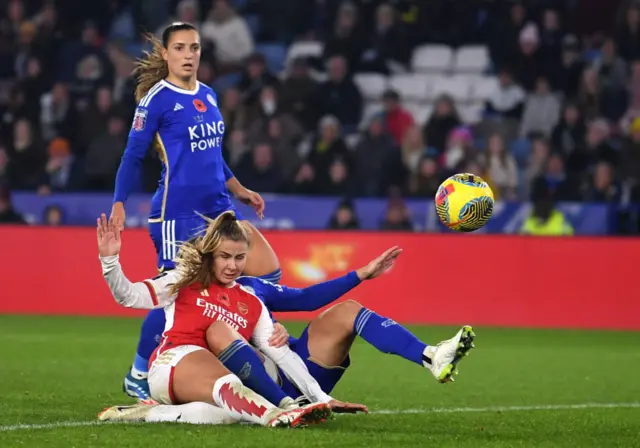 Pelova slides in among Leicester defenders to score the fourth.