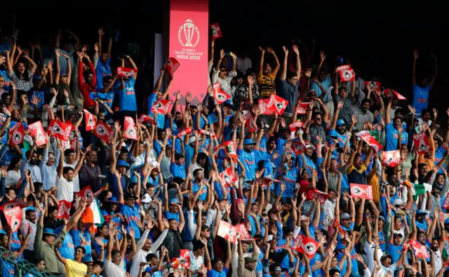 India fans celebrate a six