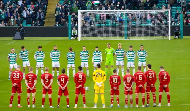 The teams line up for a period of silence