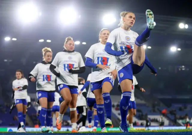 Leicester players warm up in t-shirts supporting donations for the British Legion.