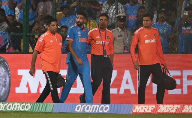 Mohammad Siraj is led off the field by medical staff