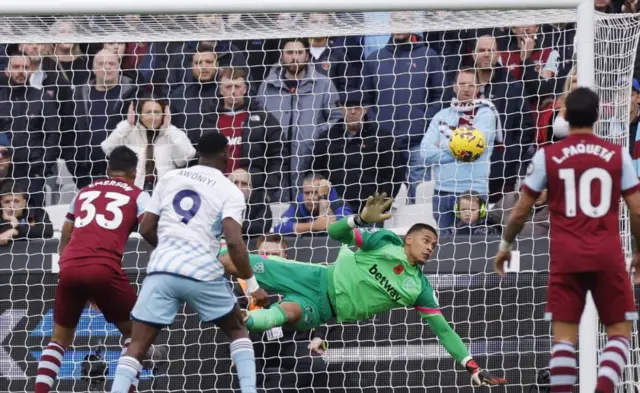 Alphonso Areola saves a effort as players look on