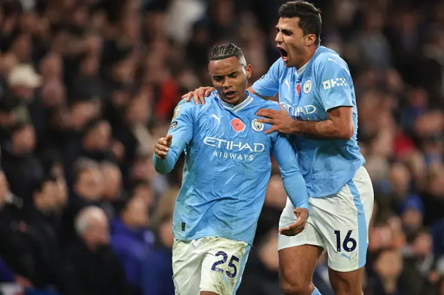 Manuel Akanji celebrates with Rodri after scoring