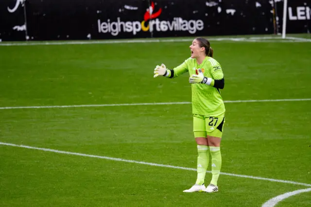 Earps shouts at her defenders after they concede a chance.