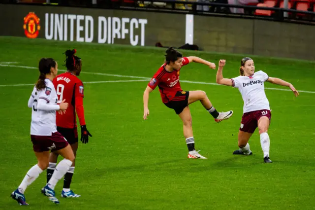 Garcia shoots at goal as teammate Malard watches on.