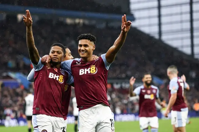 Ollie Watkins celebrates with teammates after scoring