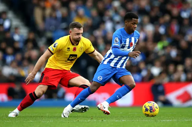 : Ansu Fati of Brighton & Hove Albion is challenged by Jack Robinson