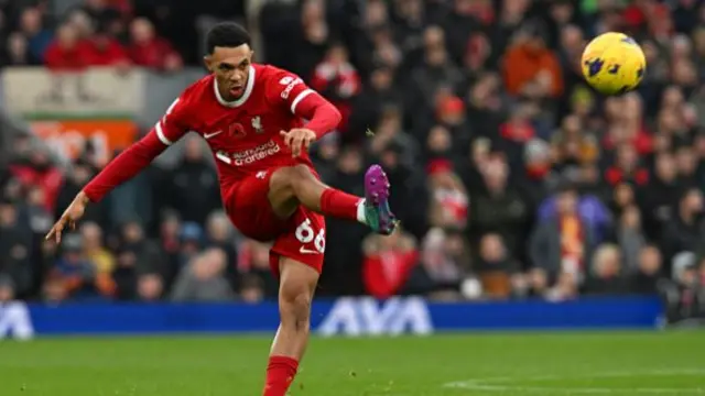 Trent Alexander-Arnold passes the ball