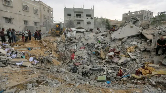 People search through rubble