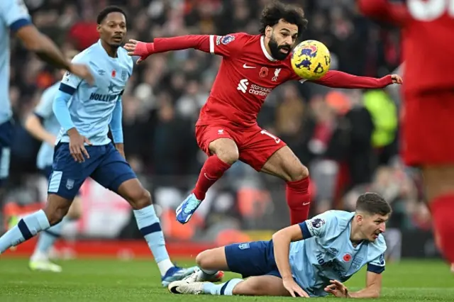 Mohamed Salah vies with Brentford's German midfielder Vitaly Janelt