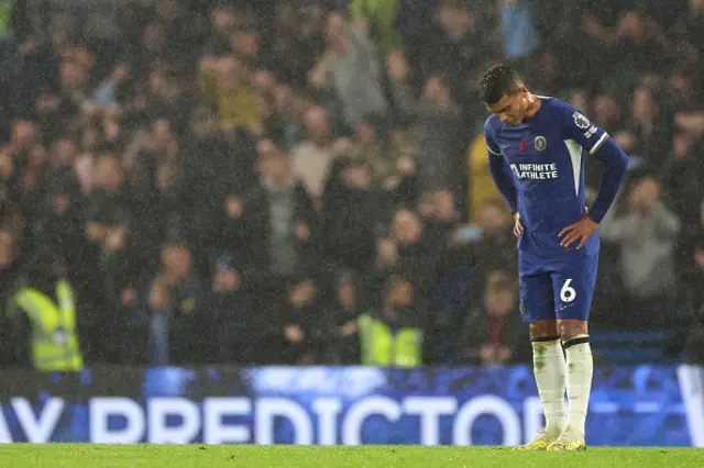 Thiago Silva looks dejected after the fourth Manchester City goal